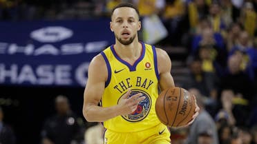 Golden State Warriors' Stephen Curry dribbles against the Oklahoma City Thunder during the second half of an NBA basketball game. (AP)