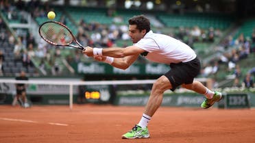 Spain's Pablo Andujar returns the ball to France's Jo-Wilfried Tsonga during the men's third round at the Roland Garros in 2015. (File photo: AFP)