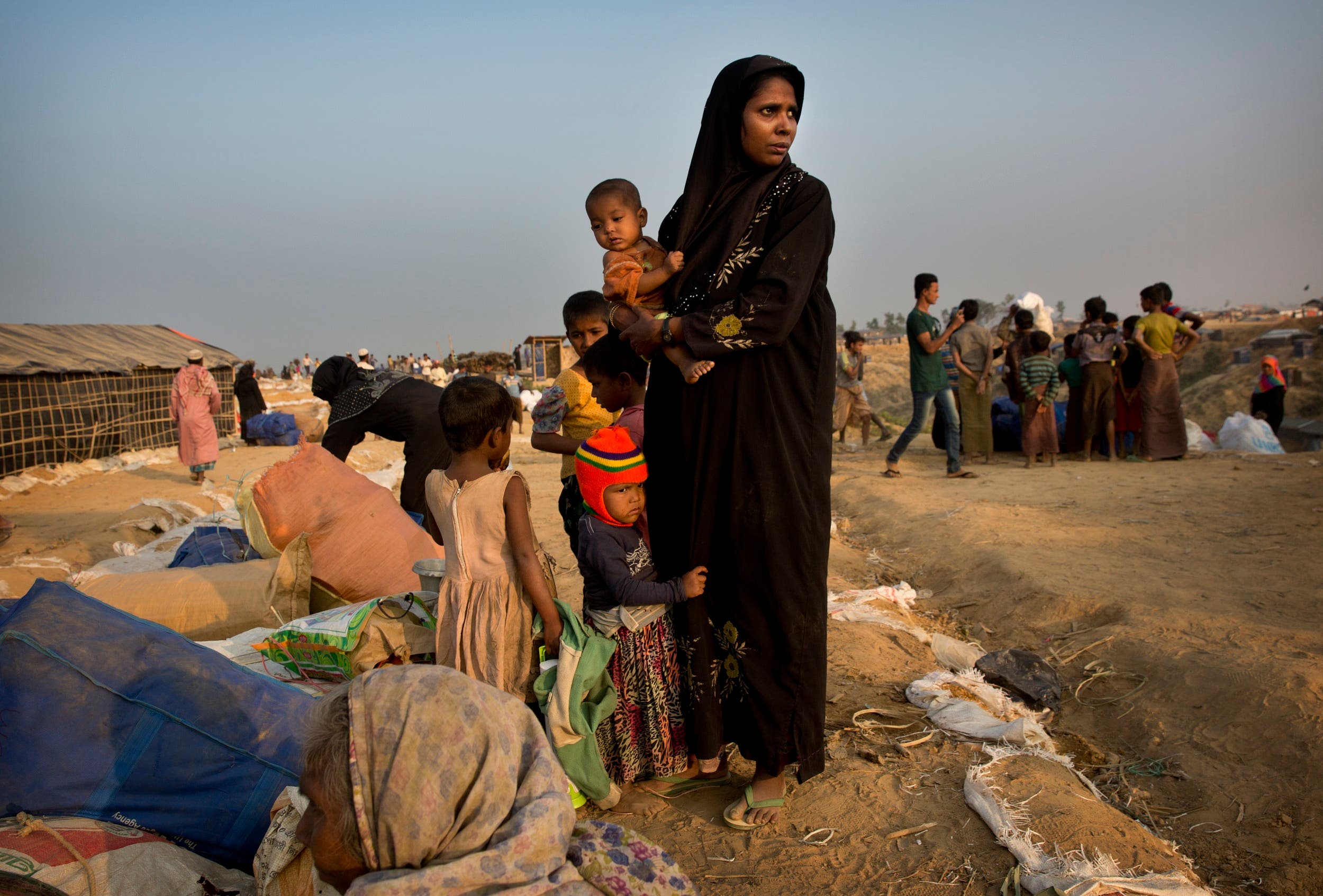 A relocated Rohingya refugee family waits to get allotted a temporary shelter after arriving at Balukhali refugee camp, 50 kilometres (32 miles) from Cox’s Bazar, Bangladesh, on Jan. 17, 2018. (AP)