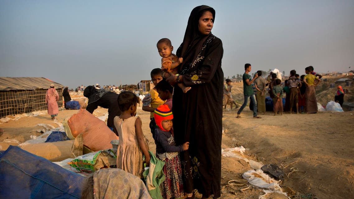 A relocated Rohingya refugee family waits to get allotted a temporary shelter after arriving at Balukhali refugee camp, 50 kilometres (32 miles) from Cox’s Bazar, Bangladesh, on Jan. 17, 2018. (AP)