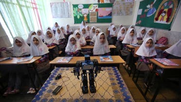  Veldan, a humanoid praying robot which is built by Iranian schoolteacher Akbar Rezaie, performs morning prayer in front of Alborz elementary school girls in the city of Varamin some 21 miles (35 kilometers) south of the capital Tehran. (AP)