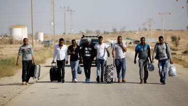 African migrants walk on a road after being released from Saharonim Prison in the Negev desert, Israel, on April 15, 2018. (Reuters)