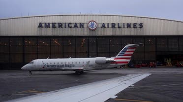 Operations proceed outside the American Airlines facilities at LaGuardia Airport on March 12, 2018, in New York. (AP)