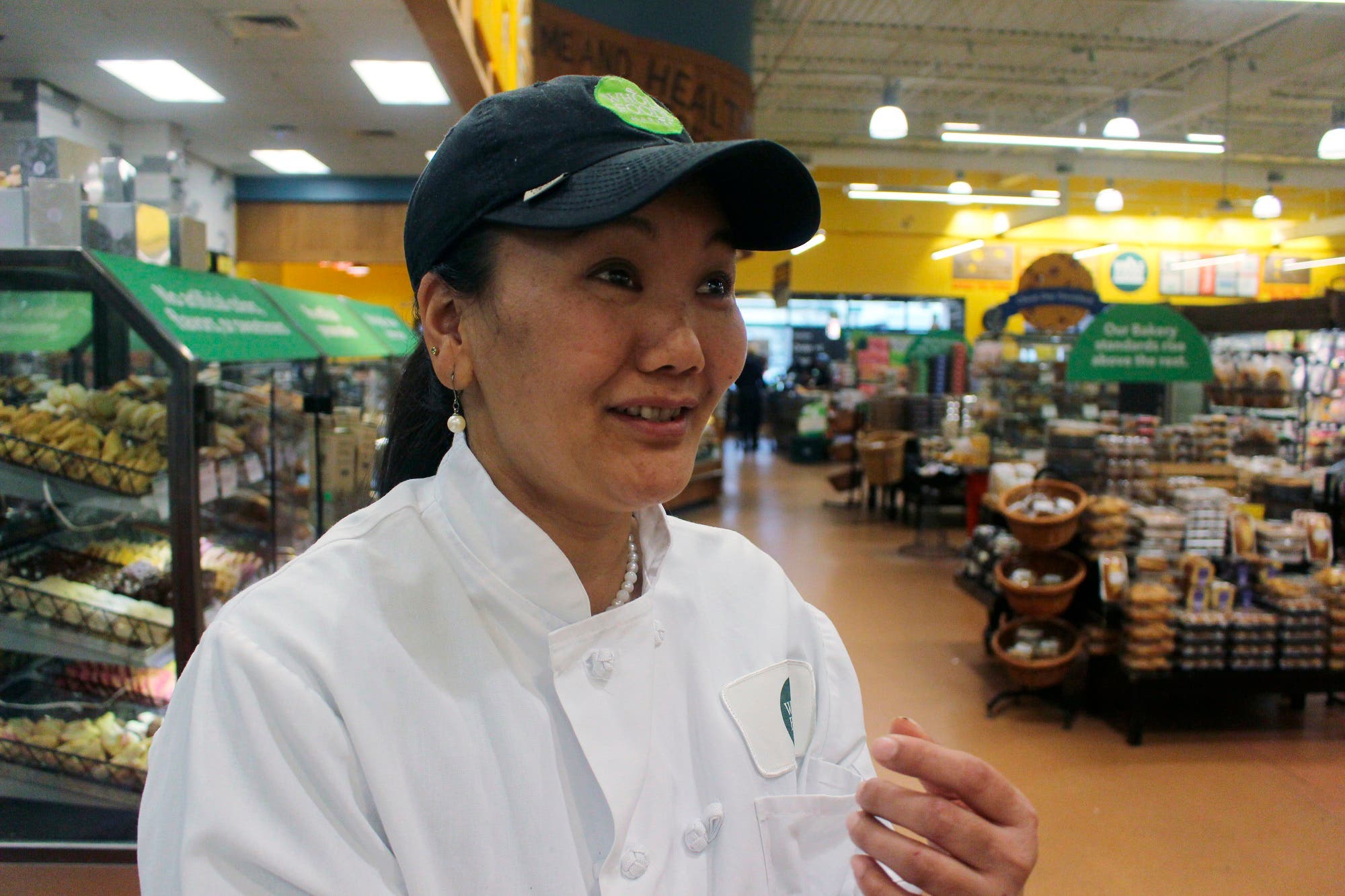 In this April 3, 2018, photo, Lhakpa Sherpa prepares to start her shift as a dishwasher at the Whole Foods Market in West Hartford, Conn. (AP)