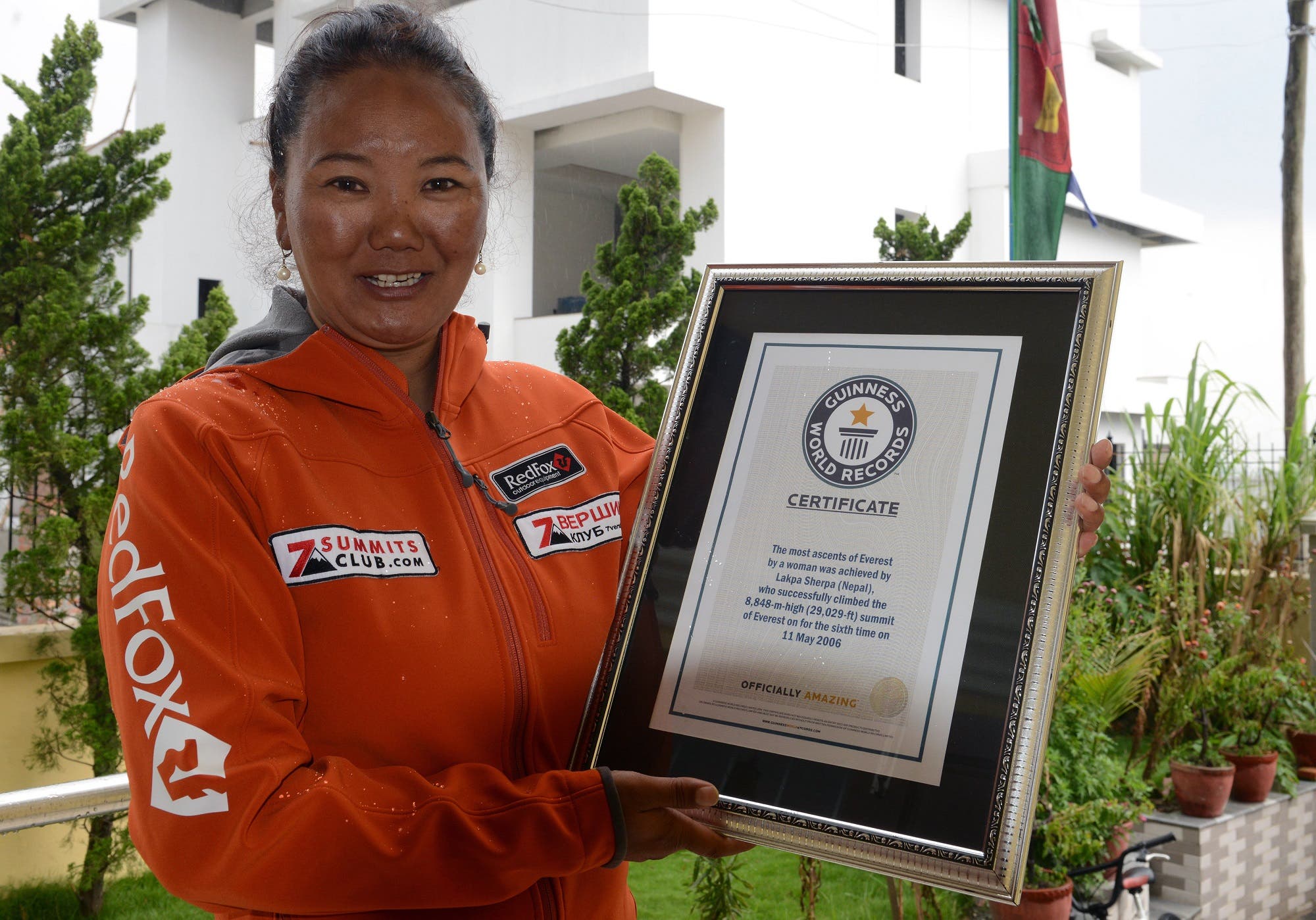 Lhakpa Sherpa poses with her Guinness record certificate in Kathmandu on May 27, 2016. (AFP)
