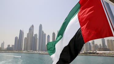 UAE flag flies over a boat at Dubai Marina, Dubai, United Arab Emirates May 22, 2015. REUTERS/Ahmed Jadallah