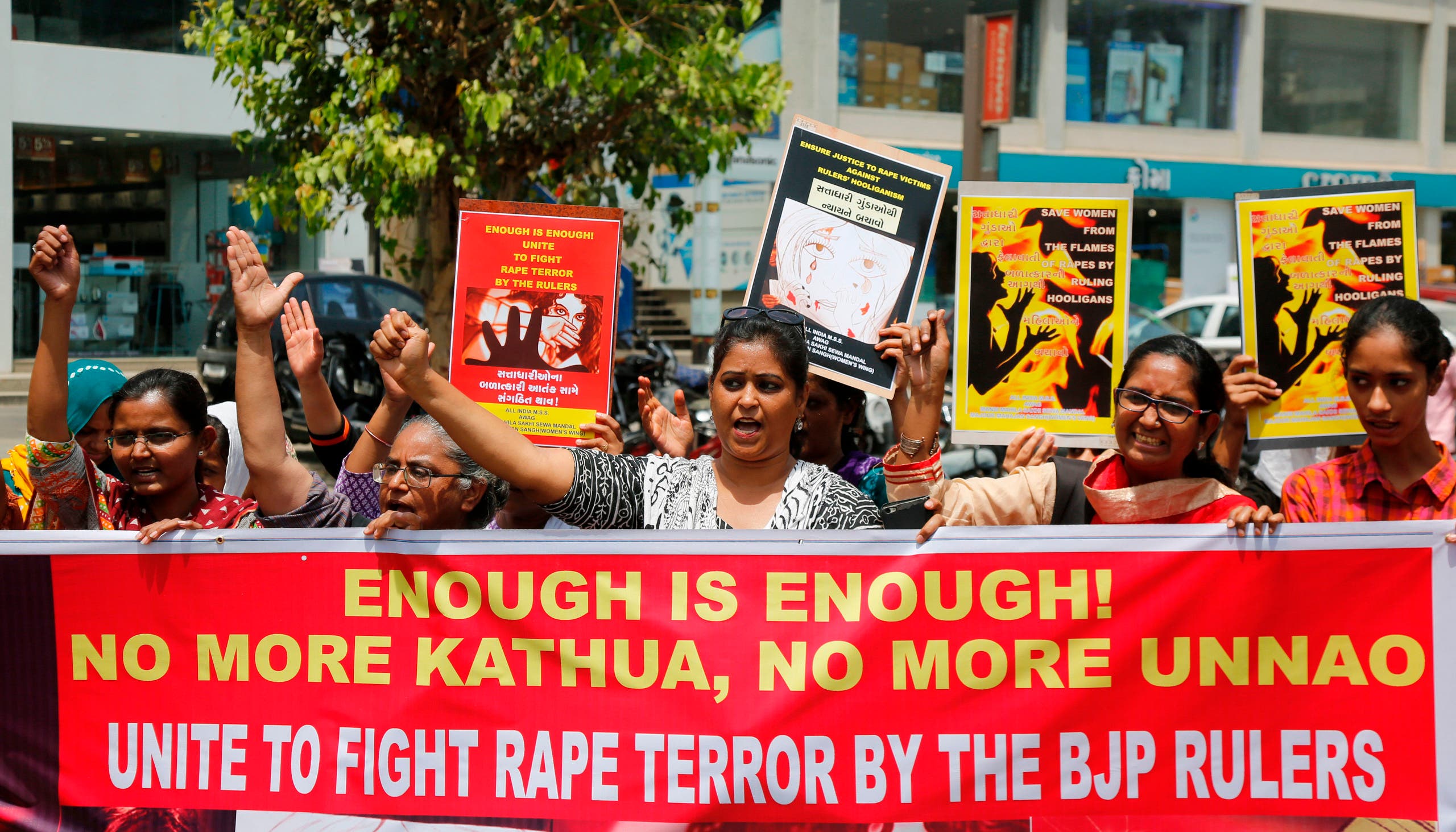 Indian women shout slogans during a protest against recent incidents of rape, in Ahmadabad, India, Friday, April 13, 2018. In 2012, the fatal gang rape of a young woman in the heart of India's capital moved Indians to take to the streets to demand stricter rape laws. But the gang rape and killing of a Muslim girl in Kathua has seen far different protests: members of a radical Hindu group have marched to demand the release of the six men accused of repeatedly raping the girl inside a Hindu temple. (AP Photo/Ajit Solanki)