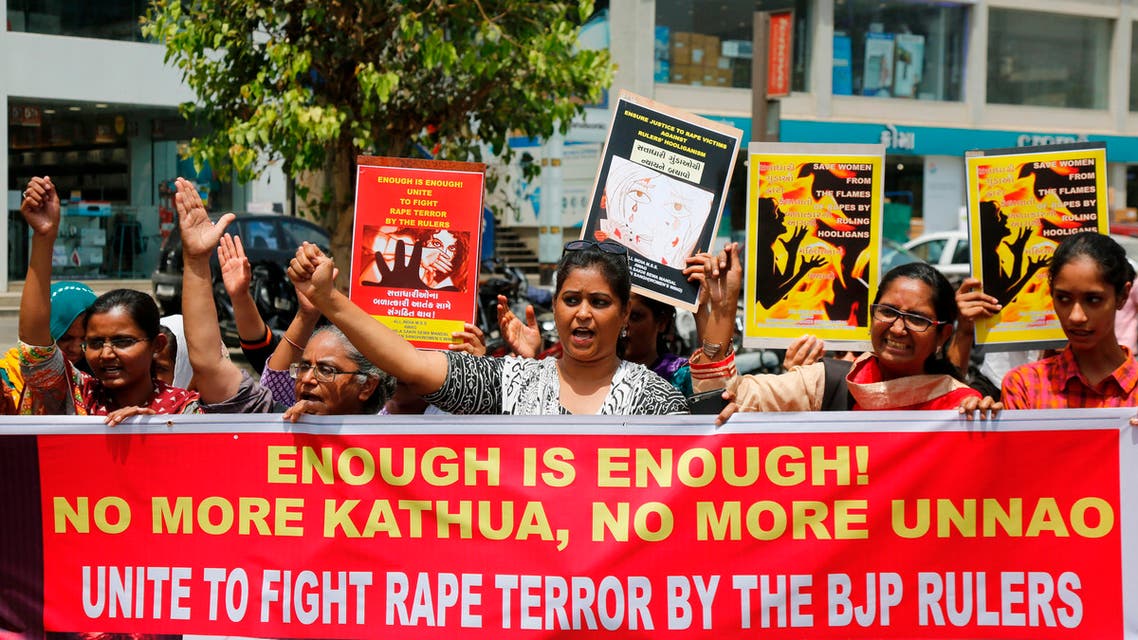 Indian women shout slogans during a protest against recent incidents of rape, in Ahmadabad, India, Friday, April 13, 2018. In 2012, the fatal gang rape of a young woman in the heart of India's capital moved Indians to take to the streets to demand stricter rape laws. But the gang rape and killing of a Muslim girl in Kathua has seen far different protests: members of a radical Hindu group have marched to demand the release of the six men accused of repeatedly raping the girl inside a Hindu temple. (AP Photo/Ajit Solanki)
