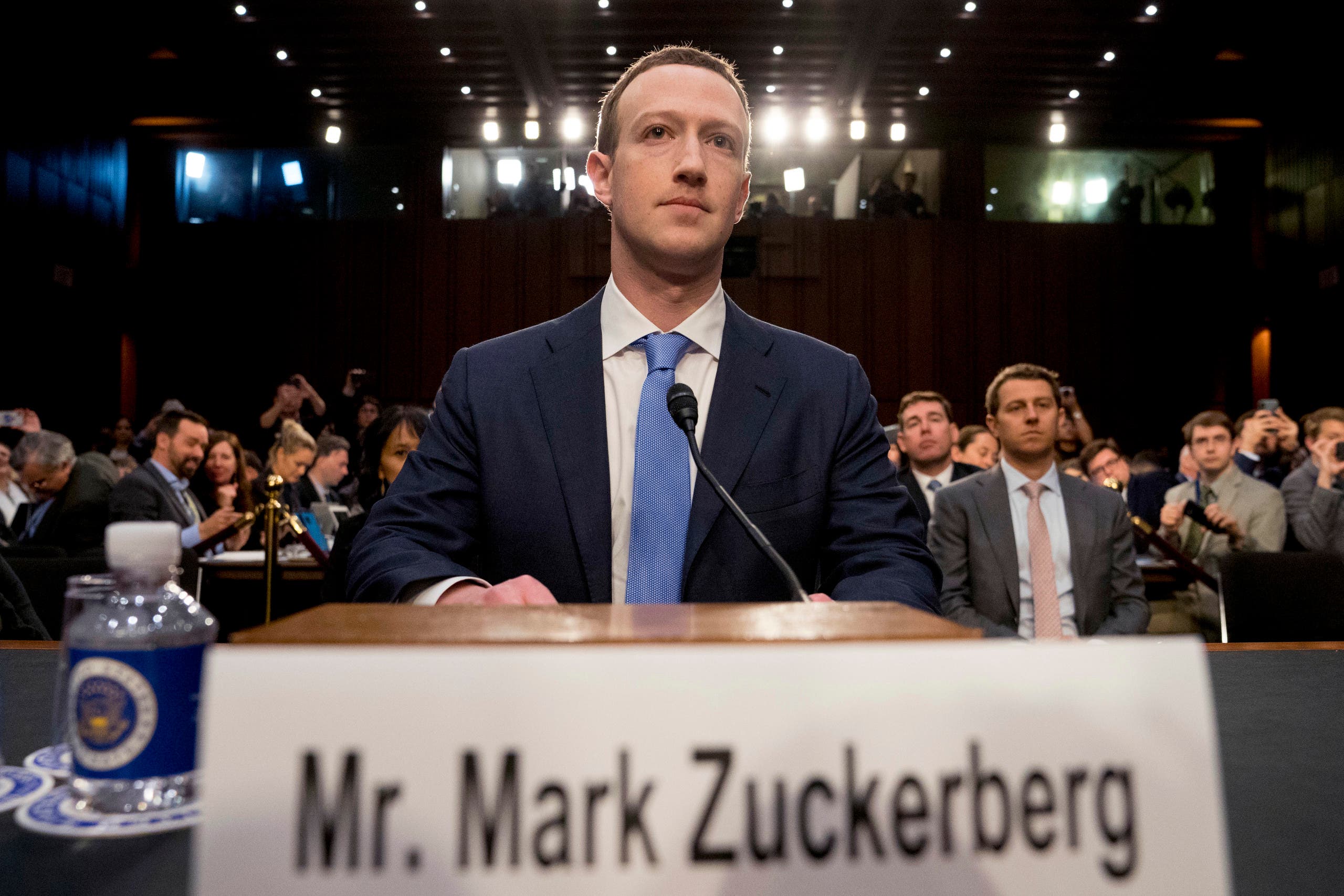 Facebook CEO Mark Zuckerberg arrives to testify before a joint hearing of the Commerce and Judiciary Committees on Capitol Hill in Washington, Tuesday, April 10, 2018, about the use of Facebook data to target American voters in the 2016 election. (AP Photo/Andrew Harnik)