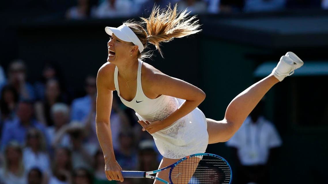 Maria Sharapova of Russia returns a shot to Serena Williams of the United States, during the women's singles semifinal match at the All England Lawn Tennis Championships in Wimbledon, London, Thursday July 9, 2015. (AP)