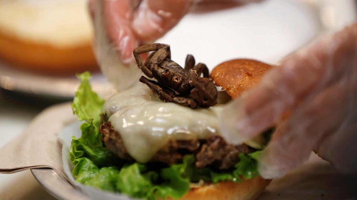 A tarantula burger is prepared at Bull City Burger and Brewery in celebration of Exotic Meat Month in Durham, North Carolina, U.S. April 16, 2018. Picture taken April 16, 2018. REUTERS/Jim Urquhart