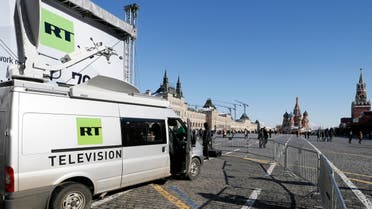 Vehicles of Russian state-controlled broadcaster Russia Today (RT) are seen at Red Square in central Moscow, Russia March 18, 2018. REUTERS/Gleb Garanich/File Photo