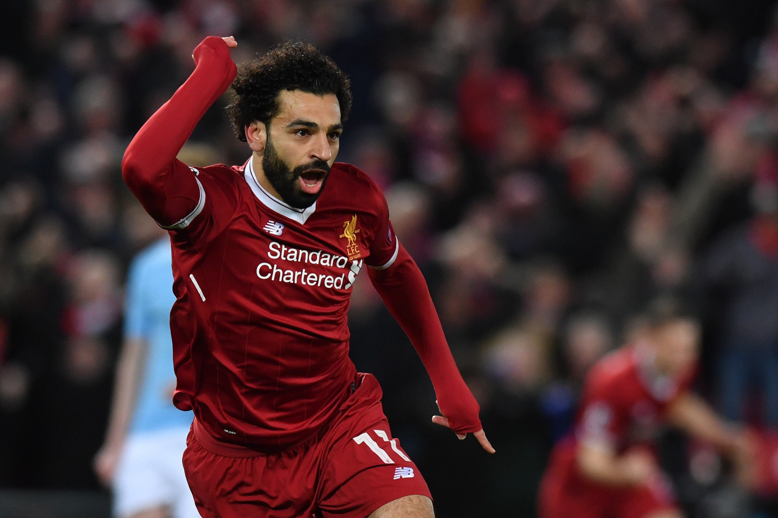 Liverpool’s Egyptian midfielder Mohamed Salah celebrates scoring the opening goal during the UEFA Champions League first leg quarter-final football match between Liverpool and Manchester City on April 4, 2018. (AFP)