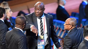 FIFA Council member Constant Omari Selemani (center) speaks with guests ahead of the 2018 FIFA World Cup football tournament final draw at the State Kremlin Palace in Moscow. (File photo: AFP)