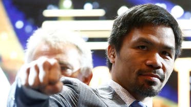 Philippine boxing icon Manny Pacquiao poses for photographers during a news conference in Kuala Lumpur. (Reuters)