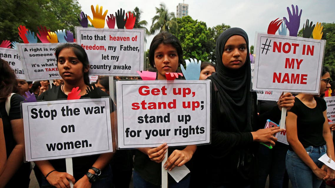 People participate in a protest against the rape of an eight-year-old girl in Kathua near Jammu, and a teenager in Unnao, Uttar Pradesh state, in Kolkata, India, April 17, 2018. REUTERS/Rupak De Chowdhuri