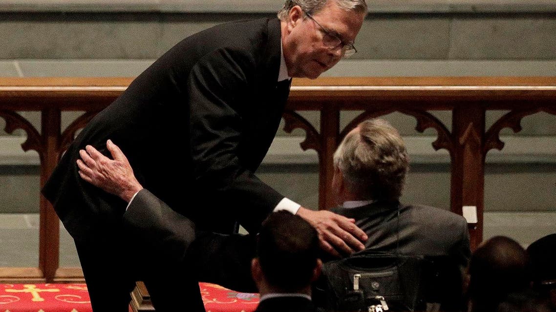 Former Florida Governor Jeb Bush comforts his father, former President George H.W. Bush during a funeral service for his mother, former first lady Barbara Bush. (AP)