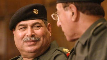 Iraqi Defense Minister Sultan Hashim Ahmad, left, and Iraqi information minister Mohammed Saeed al-Sahhaf in Baghdad in this March 23, 2003 photo. (AP)
