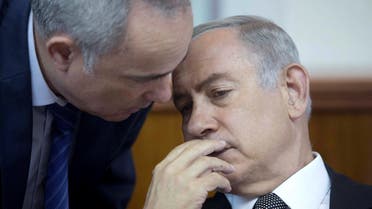 Israeli Prime Minister Benjamin Netanyahu (R) speaks with Minister of National Infrastructure, Energy and Water, Yuval Steinitz during the weekly cabinet meeting at his office in Jerusalem. (Reuters)