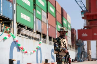 A soldier stands guard beside Cosco Wellington, the first container ship to depart after the inauguration of the China Pakistan Economic Corridor port in Gwadar on November 13, 2016. (Reuters)