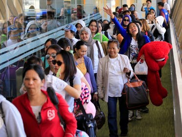 Overseas Filipino Workers (OFW) from Kuwait arrive at the Ninoy Aquino International Airport, following President Rodrigo Duterte’s call to evacuate workers after a Filipina was found dead in a freezer, in Pasay city, Metro Manila, Philippines February 23, 2018, (Reuters)