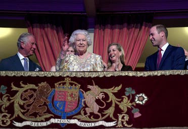 Queen Elizabeth waves next to Prince Charles and Prince William during a special concert to celebrate her 92nd birthday at the Royal Albert Hall in London on April 21, 2018. (Reuters)