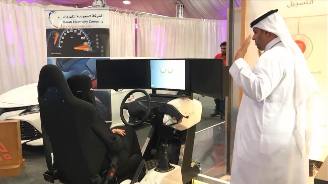 Saudi women at forum on road safety using car simmulator. (Screengrab)