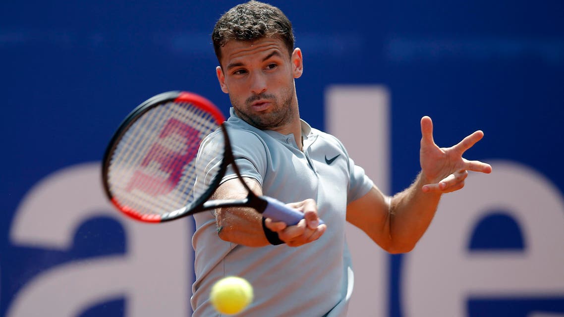 Grigor Dimitrov from Bulgaria returns the ball to Malek Jaziri of Tunisia during the Barcelona Open Tennis Tournament in Barcelona, Spain, on April 26, 2018. (AP)