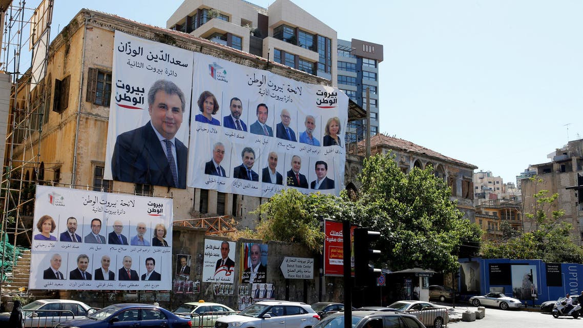 Posters with Lebanese parliament candidates are seen on a building in Beirut, Lebanon April 23, 2018. REUTERS/ Mohamed Azakir