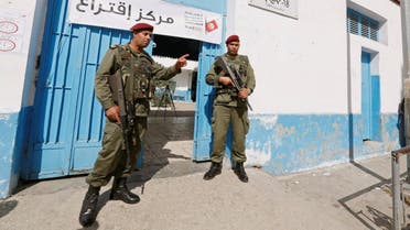 Tunisian soldiers guard a polling station as soldiers and security forces head to polls in municipal vote in Tunis. (Reuters)