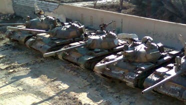 A handout picture released by Shaam News Network allegedly shows Syrian army tanks hidden inside a schoolyard before the arrival of the UN monitors to the city of Deir al-Zor. (AFP)