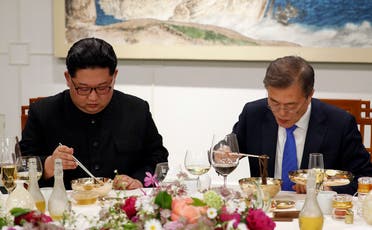 North Korean leader Kim Jong Un, left, and South Korean President Moon Jae-in, right, eat Pyongyang Naengmyeon or cold buckwheat noodles during a banquet at the border village of Panmunjom in the Demilitarized Zone, South Korea. (AP)