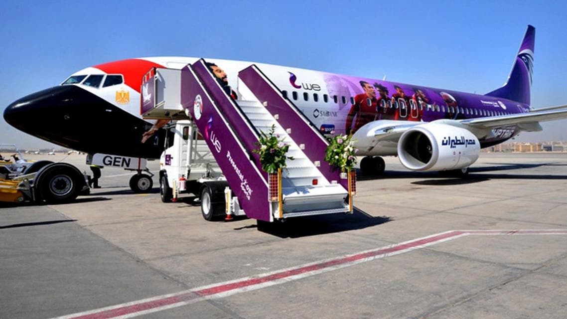 In this Tuesday, March 20, 2018 photo released by Egypt's national Airline, Egypt Air, a plane specially decorated for the Egyptian national football team, that will take them to Russia for the 2018 FIFA World cup, is parked at Cairo Airport, Egypt. (AP)