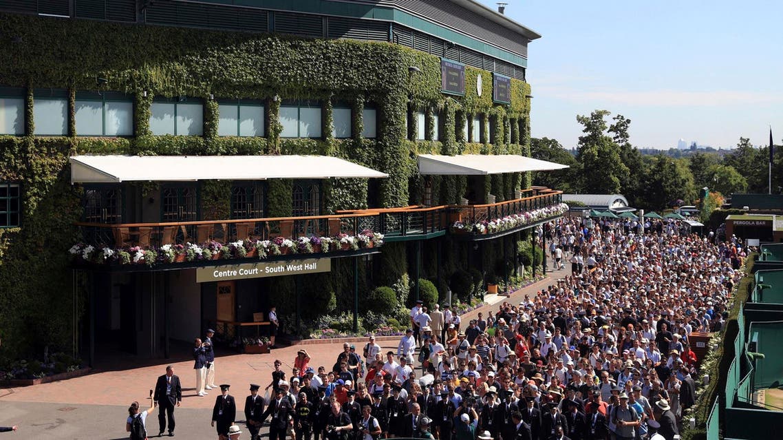 Spectators are led into the grounds at The All England Lawn Tennis and Croquet Club, Wimbledon, on July 7, 2017. (AP)