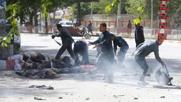ATTENTION EDITORS - VISUAL COVERAGE OF SCENES OF INJURY OR DEATH Policemen help Afghan journalists, victims of a second blast, in Kabul, Afghanistan April 30, 2018. REUTERS/Omar Sobhani TEMPLATE OUT TPX IMAGES OF THE DAY