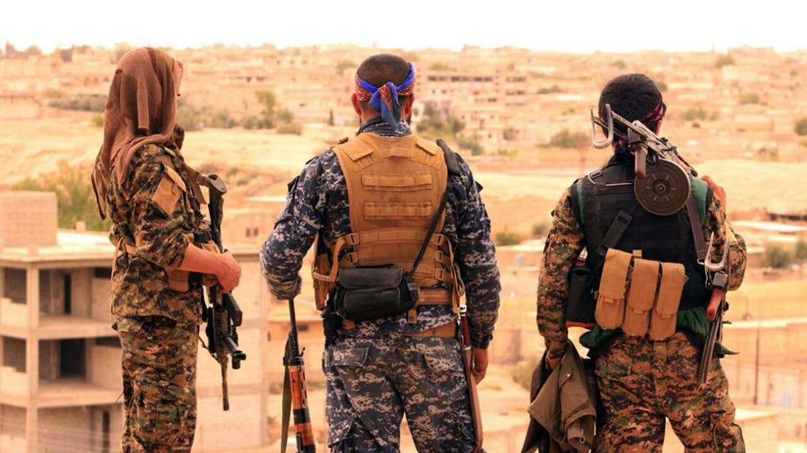 Fighters from the SDF looking toward the northern town of Tabqa, Syria. (File photo: AP)