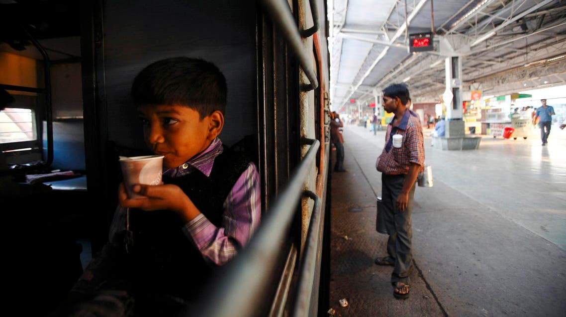 A boy drinks tea inside a train at Agra Cantt Railway Station on October 24, 2012. (File photo: Reuters)