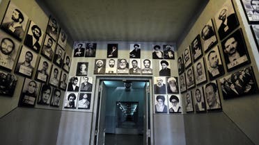 A picture taken on September 2, 2014 in Tehran shows portraits of detainees in “Qasr prison”, a former prison hosting political prisoners that was turned into a museum in 2012. (AFP)