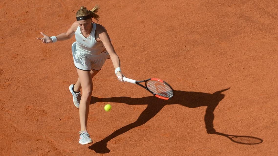 Petra Kvitova of the Czech Republic returns the ball to Romania's Mihaela Buzarnescu during their final tennis match at the WTA Prague Open. (AFP)