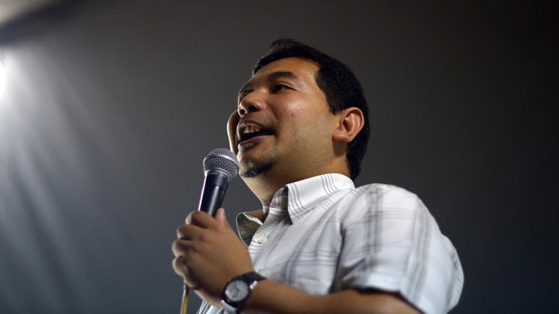 Rafizi Ramli, the strategist for the polical party of opposition leader Anwar Ibrahim, speaking at a late night corner meeting in Kuala Lumpur. (AFP)