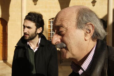 Lebanese Druze leader Walid Jumblatt walks with his eldest son Taymur (L) at their ancestral home in Mukhtara in Lebanon's Shouf mountains, southeast of Beirut, on Januray 16, 2010. (AFP)