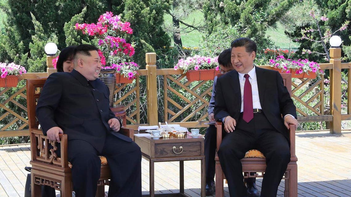 Chinese President Xi Jinping, right speaks to North Korean leader Kim Jong Un in Dalian in northeastern China's Liaoning Province. (AP)
