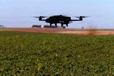 A drone which supplies tools for connected agriculture is flown over French rapeseed field on February 16, 2018. (AFP)