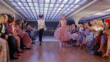 A model walks on the catwalk displaying creations by Russian designer Tatiana V. Lyalina during Arab Fashion Week in Dubai on May 9, 2018. (AFP)