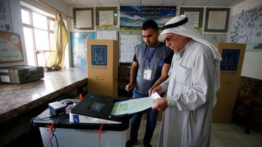 An Iraqi man casts his vote at a polling station during the parliamentary election in Mosul, Iraq May 12, 2018. REUTERS/Khalid al-Mousily