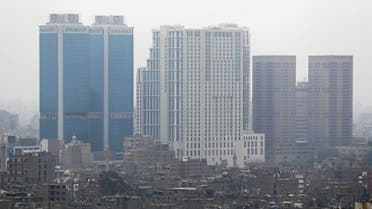 National Bank of Egypt head offices, the St. Regis Cairo hotel and Hilton Cairo World Trade Center Residences are seen towering above residential buildings in the downtown Cairo, Egypt, May 6, 2018. (Reuters)