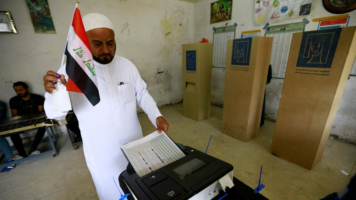 An Iraqi man casts his vote at a polling station during the parliamentary election in Baghdad, Iraq May 12, 2018. REUTERS/Thaier al-Sudani