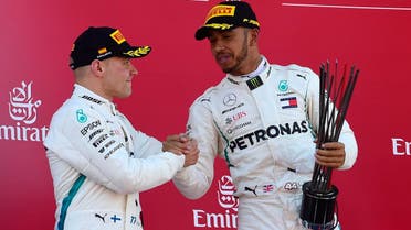 Lewis Hamilton (right) celebrates on the podium with second placed Valtteri Bottas after winning the Spanish Formula One Grand Prix at the Circuit de Catalunya in Montmelo in the outskirts of Barcelona on May 13, 2018. (AFP)