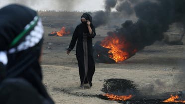 Female Palestinian demonstrator walks during a protest against US embassy move to Jerusalem. (Reuters)