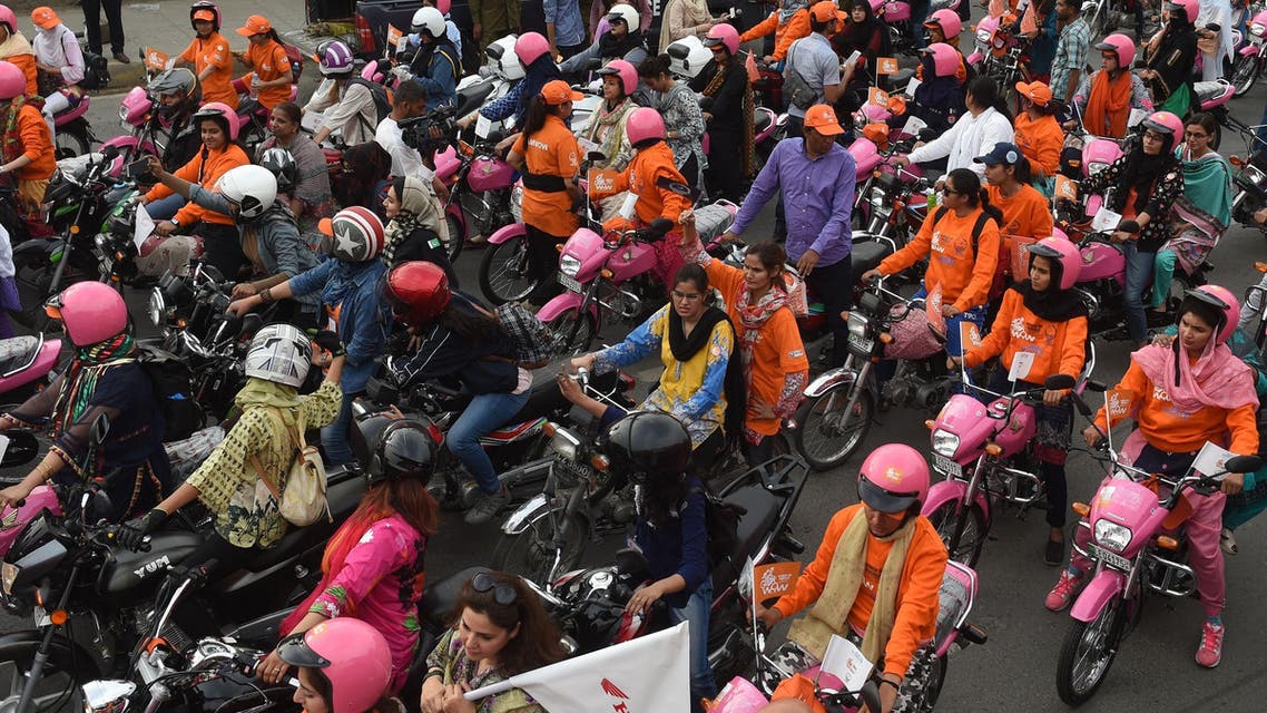 Pakistani women ride pink motorcycles during the rally in Lahore on May 13, 2018. (AFP)